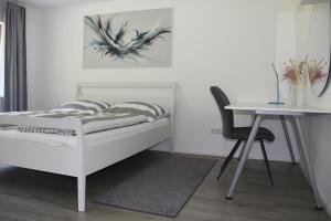 Ένα ή περισσότερα κρεβάτια σε δωμάτιο στο Top Wohnung in Refrath bei Köln