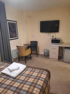 Voodi või voodid majutusasutuse Dalkeith Aparthotel toas