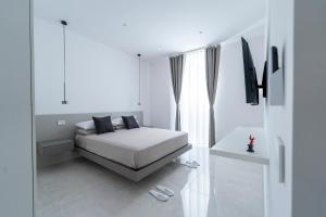Postel nebo postele na pokoji v ubytování Alberti Apartments