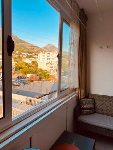 a window with a view of a city at Levant in Sutomore