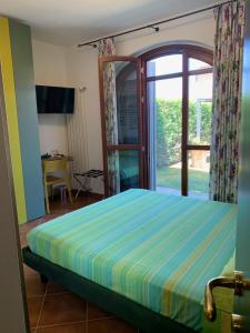 A bed or beds in a room at Casa Paola nel Chianti