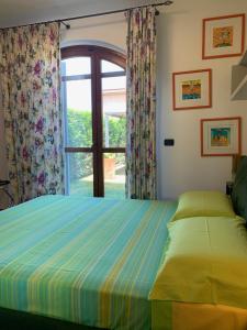A bed or beds in a room at Casa Paola nel Chianti