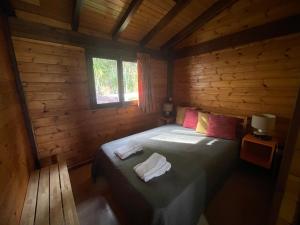 En eller flere senge i et værelse på Casa do Casal