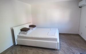 a white bed with two pillows on it in a room at Villa Nature Sarajevo in Sarajevo +20 photos