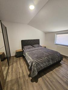 Postel nebo postele na pokoji v ubytování Apartman Ivan