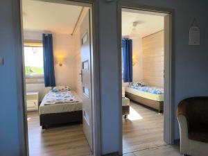 En eller flere senge i et værelse på Domki U Marty - Domek Grażyna