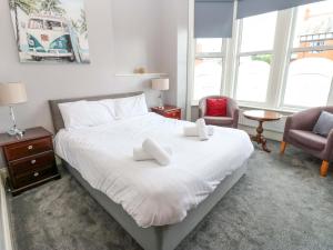 Ένα ή περισσότερα κρεβάτια σε δωμάτιο στο Fern Lee