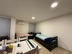 Apartamentos El Fortín客房内的一张或多张床位