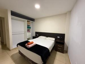 Apartamentos El Fortín客房内的一张或多张床位
