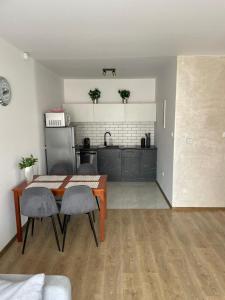 Η κουζίνα ή μικρή κουζίνα στο Apartamenty Paradise
