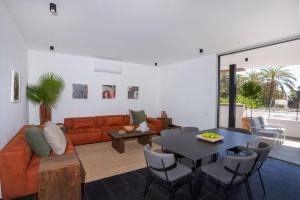 a living room with a couch and a table at Bridge House 201 - 3BR Penthouse in Limassol