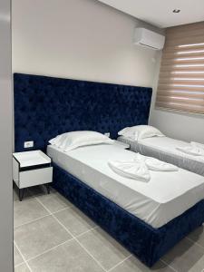 Postel nebo postele na pokoji v ubytování Shengjin Luxury apartment