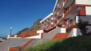 a building with stairs and a mountain in the background at Altamira in Bajamar