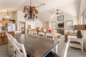 a dining room and living room with a table and chairs at Good Sun-Sations in Corolla +52 photos