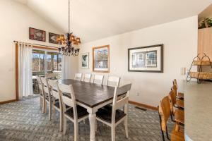 a dining room with a table and chairs at Good Sun-Sations in Corolla