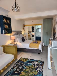 Ένα ή περισσότερα κρεβάτια σε δωμάτιο στο G's Apartments Cape Town