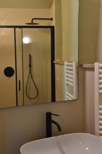 a bathroom with a sink and a mirror at La Vecchia Scuola in Stifone