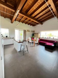 a living room with a couch and a table at Torre Menerva Viterbo Guest house & SPA in Bullicame