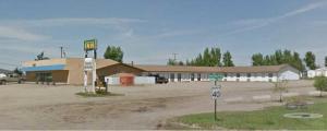 an empty parking lot in front of a gas station at Macklin Motor Inn in Macklin