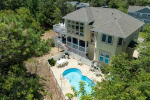 an aerial view of a house with a swimming pool at Its All Good In Corolla in Corolla +56 photos