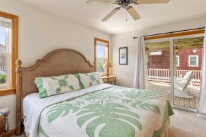 a bedroom with a bed and a balcony at Jockeys Ridge 385 in Nags Head +59 photos