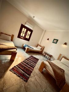 Postel nebo postele na pokoji v ubytování Jungle Dahab Hotel