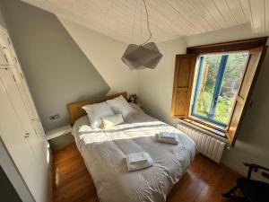 Cama o camas de una habitación en Casa do Bidueiro