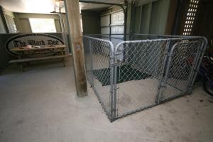 a metal gate in a room with a sign at Lauren Lee in Nags Head +34 photos