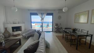 A seating area at NV seafront villa Aegina 1