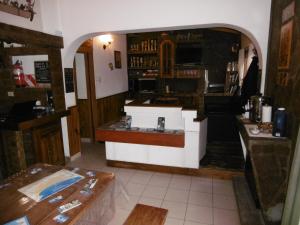 a bar in a restaurant with a counter in a room at Hostel La Casa de Tounens in Puerto Madryn