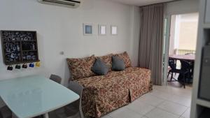 Χώρος καθιστικού στο Flat Aconchegante no Club Meridional Carneiros bLP