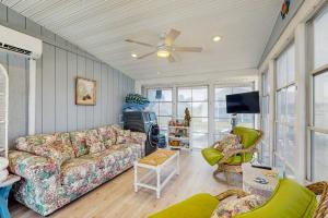 a living room with a couch and a tv at Ocean View --- 38253 Piney Point Rd in Ocean View