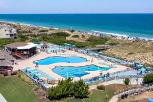 an aerial view of a pool at the beach at Let Me Count The Waves in Corolla