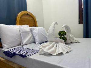 Postel nebo postele na pokoji v ubytování Hello Rafiki GuestHouse - Mkunazini