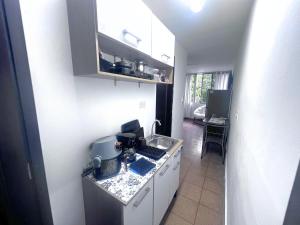 Η κουζίνα ή μικρή κουζίνα στο Suite con cocina pequeña y baño privado
