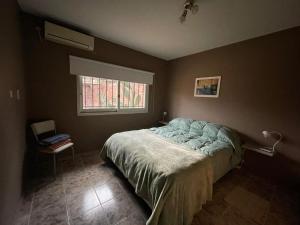 Ένα ή περισσότερα κρεβάτια σε δωμάτιο στο Barrio el Trebol A1