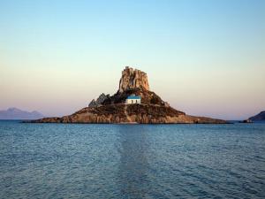 a small island in the middle of the water at Antonis Hotel in Kefalos