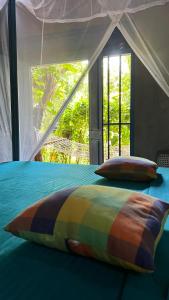 Postel nebo postele na pokoji v ubytování Kataragama Homestay
