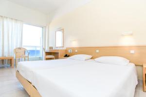 Cama ou camas em um quarto em Hotel Riviera