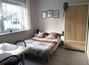 Łóżko lub łóżka w pokoju w obiekcie U Szwagra