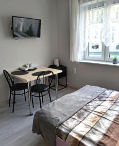 Łóżko lub łóżka w pokoju w obiekcie U Szwagra