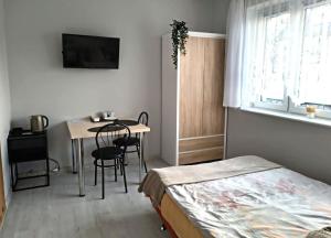 Łóżko lub łóżka w pokoju w obiekcie U Szwagra