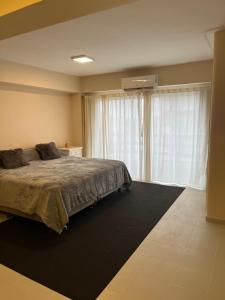 Ένα ή περισσότερα κρεβάτια σε δωμάτιο στο Dpto SANTIAGO