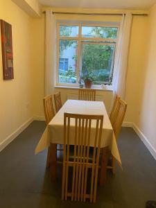 a dining room with a table and chairs and a window at Langham Lake House in Simpson +31 photos