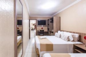 Postel nebo postele na pokoji v ubytování Amuarama Hotel