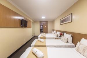 Postel nebo postele na pokoji v ubytování Amuarama Hotel
