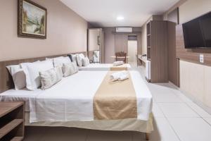 Postel nebo postele na pokoji v ubytování Amuarama Hotel