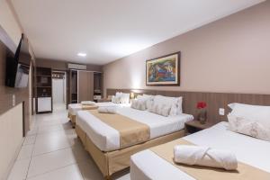 Postel nebo postele na pokoji v ubytování Amuarama Hotel