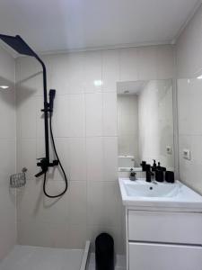 a white bathroom with a sink and a shower at Green Agarak 2 near Dendropark, Stepanavan in Gyulagarak +23 photos