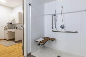 a bathroom with a shower stall and a sink at Studio 6 Toronto - Mississauga with Kitchenettes in Mississauga